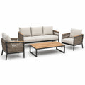 Set divano da giardino in metallo e vimini con cuscini beige