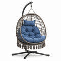 Sedia a dondolo sospesa in metallo e rattan sintetico con cuscino blu